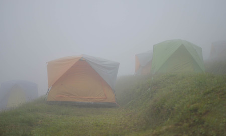 Tent camping  looking blur in mist and cold weatherの写真素材