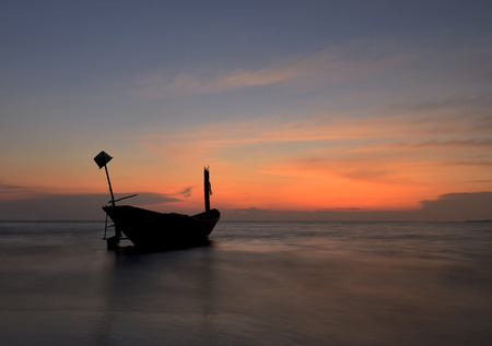 silhouette boat at sunsetの写真素材