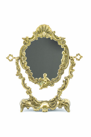 Antique brass mirror frame on white backgroundの写真素材