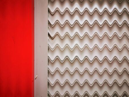 linear zig zag design with  vivid red and white geometric symmetric abstract patternsの写真素材