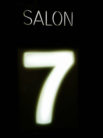 salon illuminated sign number numeral seven 7 black background