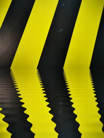 water reflection pattern all based on multiple black diagonal on a vibrant yellow chevronの写真素材