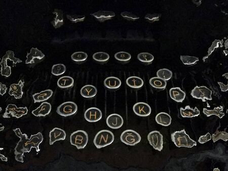 vintage mechanical hand typewriter letter keys with distortion effect making abstract patterns and...
