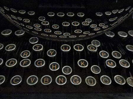 vintage mechanical hand typewriter letter keys glass globe  making abstract patterns and design in...
