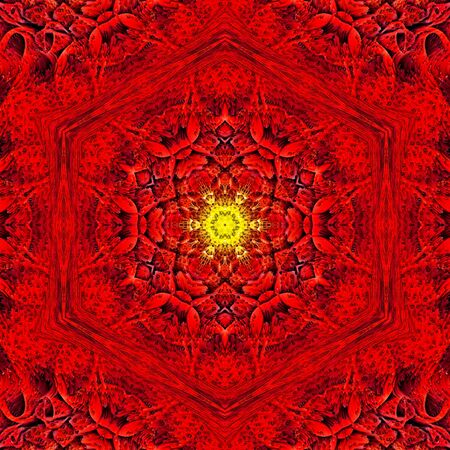 red dahlia bud head with small yellow delicate center viewed in closeup detail and transformed in to patterns and intricate designsの写真素材