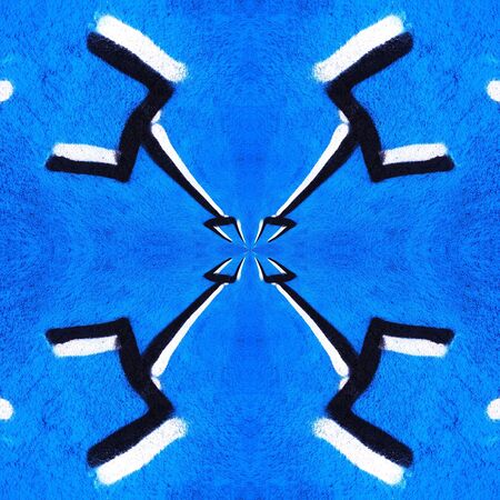 two pronged fork design in black and white against a vivid royal blue a textured wall transformed into intricate patterns by reflection and twistingの写真素材