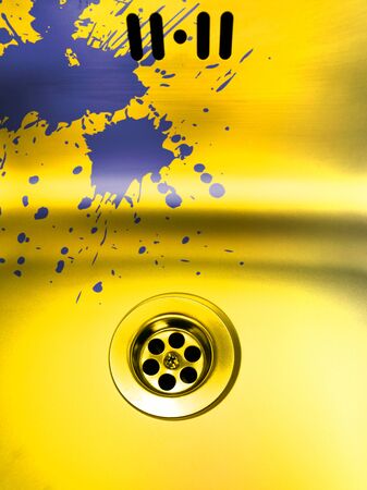 paint stains on overflow and plug hole domestic golden steel sink over layered to form vibrant colors shapes patterns and designsの写真素材