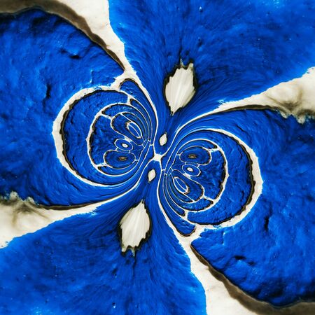 newly painted royal vivid blue wall with white mortar with cyclone type patterns and designsの写真素材