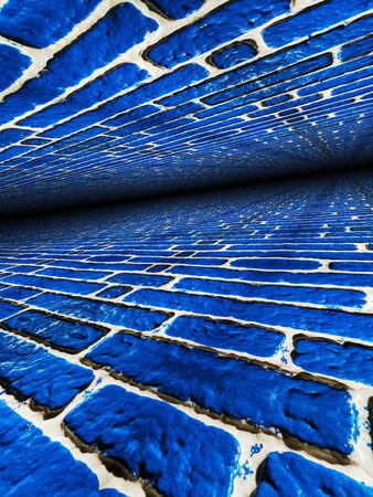 3D  surface view of a newly painted royal vivid blue wall with white mortarの写真素材