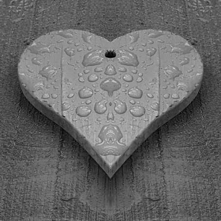 patterns and designs of green wooden heart on blue background with rain dropsの写真素材