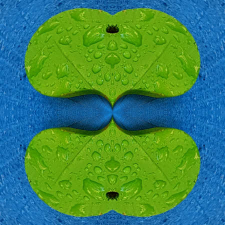 patterns and designs of green wooden heart on blue background with rain dropsの写真素材