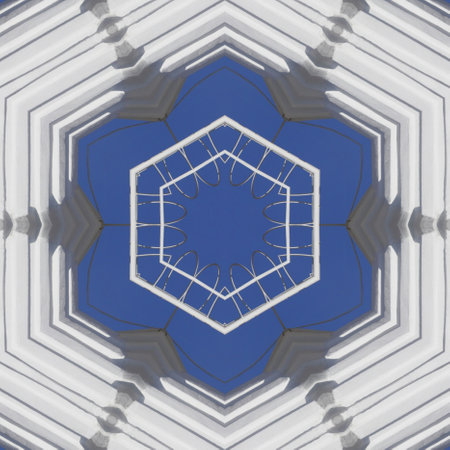 white industrial chimney with side access ladders cloudless blue skyの写真素材