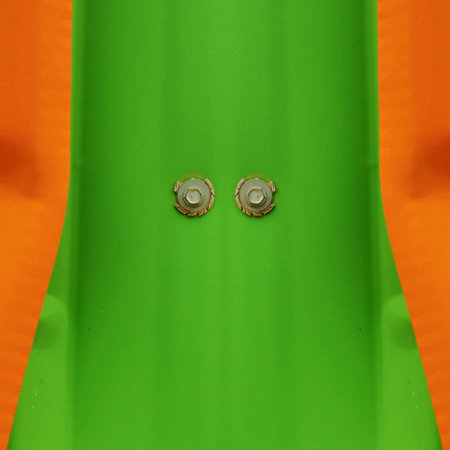 shades of green and orange painted steel sheets to intricate futuristic patterns and 3D illustration designsの写真素材