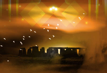 stylized megalith silhouetted against dramatic evening skyの写真素材