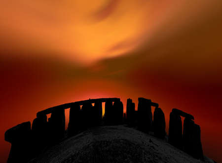 stylized megalith silhouetted against dramatic evening skyの写真素材