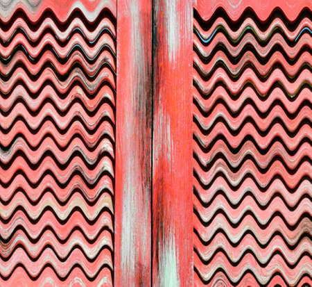 vintage traditional red painted weathered wooden shutters patterns and designs on a black background