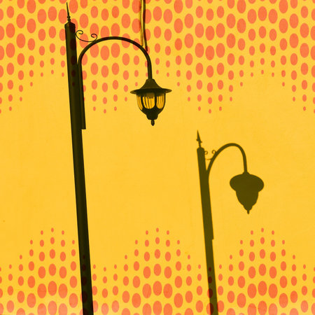 Vintage street lamp on yellow background with dots. creative illustration.の写真素材