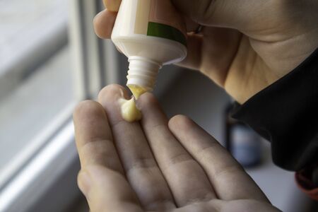 The cream is squeezed out of the tube. Cream on the hand. Cosmetics