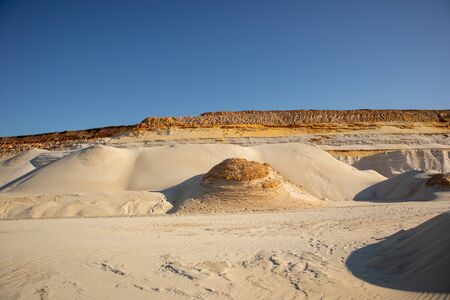 Embossed sand mountains of white sands. Desert landscape.の写真素材