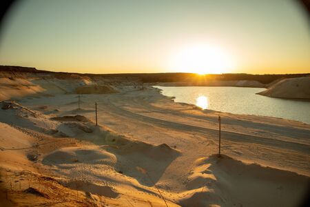 Footprints in the sand in the desert. The road to the oasis. Sunset.の写真素材