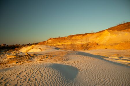 Sand waves in the desert. Bushes in the sand. Ukrainian nature.の写真素材