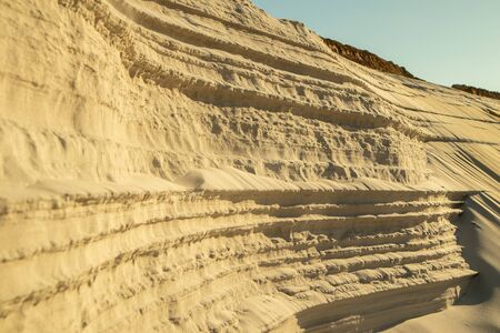 Embossed sand mountains of white sands. Desert landscape.の写真素材