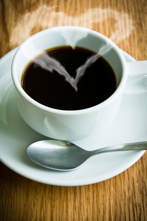 Coffee cup with heart-shaped  smokeの写真素材