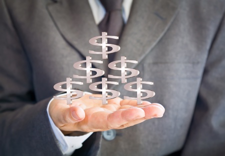 Business man showing dollars signの写真素材