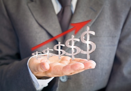 Business man showing dollars sign graphの写真素材