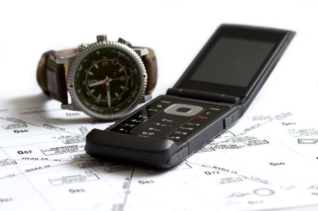 telephone and watch on the tableの写真素材