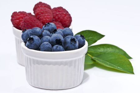 Blueberry and Raspberry in White Bowlの写真素材