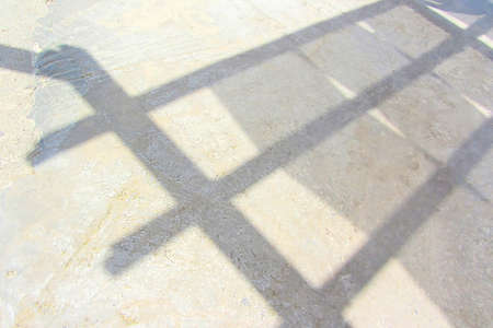 Shade on the pier from the wooden awning. Summer holidays at the seaside. Architecture Abstract Background With Geometric Linear Pattern From Metalwork Or Framework And Black Parallel Shadows In Perspective View. Sundeck Pierの写真素材
