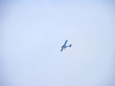 Flight Design CTSW. Zoom photo of small propeller airplane landing to small airport.