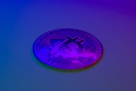 Cryptocurrency blue coin with bitcoin symbol isolated on black background. Bitcoin Coin on colored background. bitcoin cryptocurrency. Cryptocurrency Coin Concept. single golden valuableの写真素材