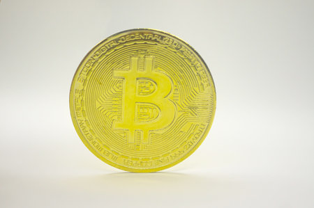Gold coin Bitcoin on white background. The concept of cryptocurrencies. blockchain technology. Gold reflectの写真素材