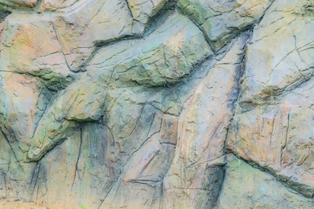 Background of stone wall texture, closeup of photo, Thailand.の写真素材