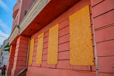 Wooden boards on the facade of a building in the city.の写真素材