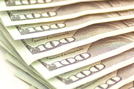 Background of 100 dollars. Macro, close-up money. Lots of 100 dollar bills, the concept of US cash...