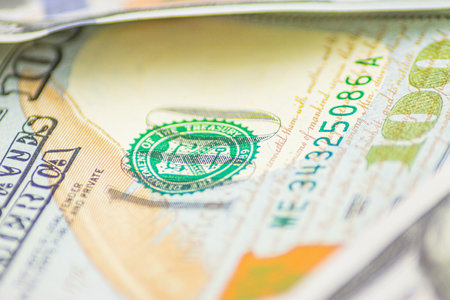 Background of 100 dollars. Macro, close-up money. Lots of 100 dollar bills, the concept of US cash...
