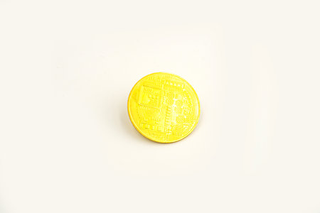 Bitcoin isolated on white background. Cryptocurrency - photo of golden bitcoin physical gold coin....