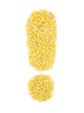 Exclamation mark from grain of millet on isolated white background.の写真素材