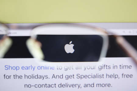 Moscow, Russia - 15 November 2020: Apple home page browsing through glasses, company logo. High quality photoのeditorial素材