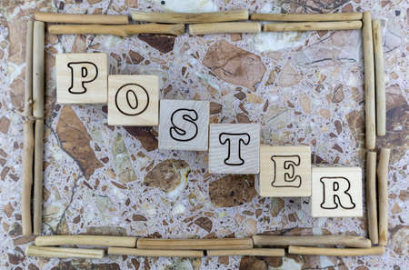 Poster - concept with alphabet letters on cubes inside a rustic wooden frame made of cut off branches of wood over a marbled stone background. Flat layの写真素材