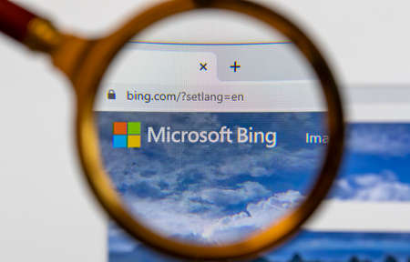 Moscow, Russia - 31 March 2021: View the Microsoft Bing homepage through a golden magnifier, company logo. High quality photoのeditorial素材