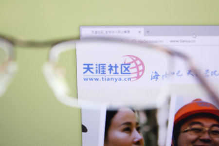 Moscow, Russia - 15 November 2020: Tianya home page browsing through glasses, company logo. High quality photoのeditorial素材