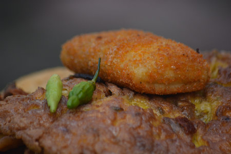 Macro shot focusing on fried snack surface and seasoning details creating an appetizing textured...