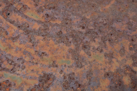 High resolution texture of oxidized rusty metal showing organic corrosion patterns, perfect for...