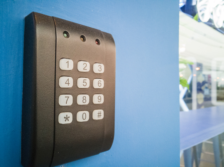 black security door have a number bottom and led light red yellow green.,electronic access control...