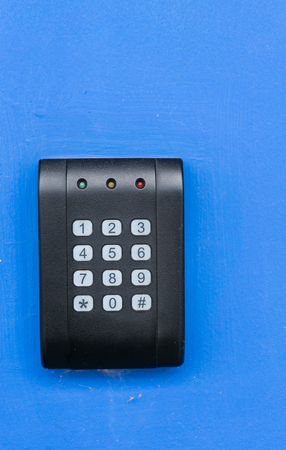 black security door have a number bottom and led light red yellow green.,electronic access control...