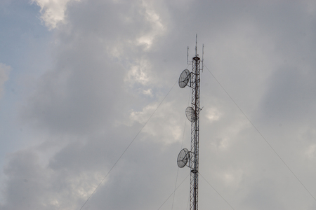 elecommunication mast TV antennas wireless technology with cloud sky in the evening.の写真素材